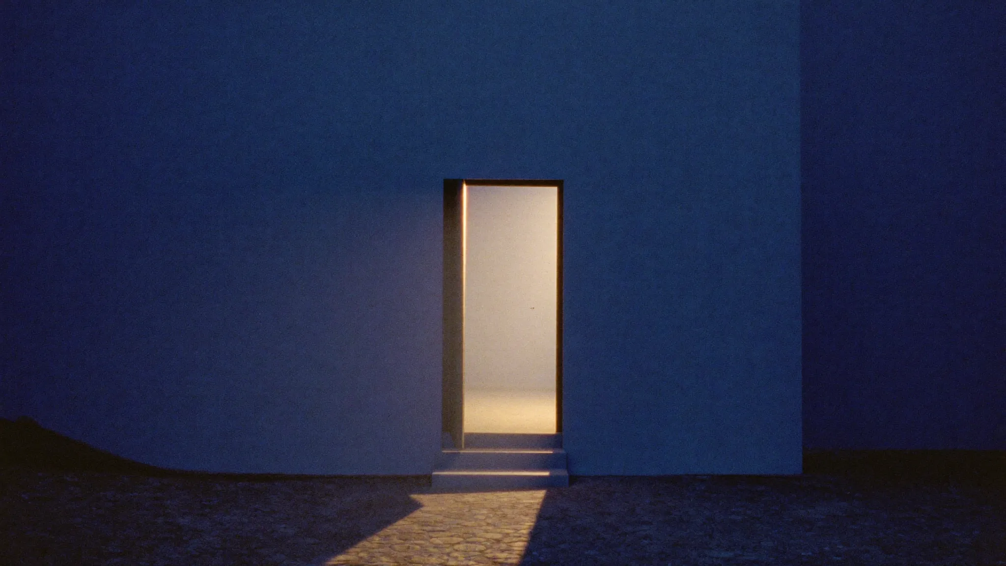 An open doorway glowing with warm light